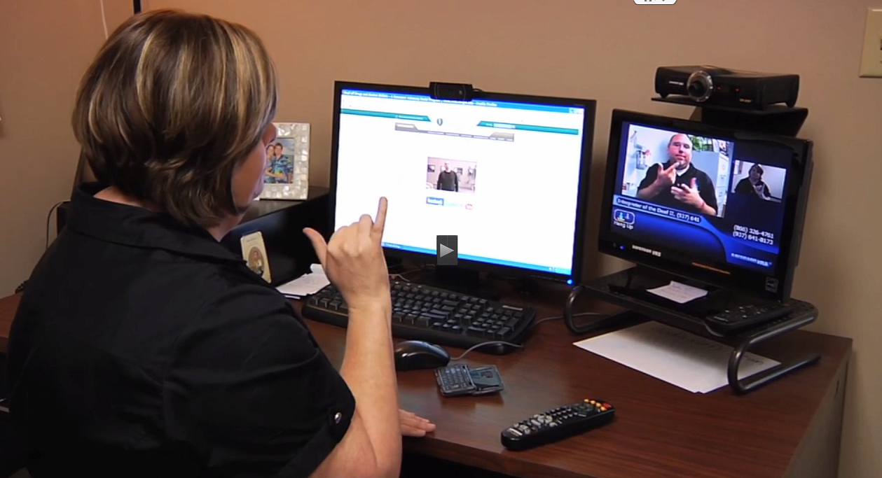 Counselor using American sign language by video phone